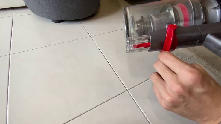 Dyson bin release button stuck, can not open